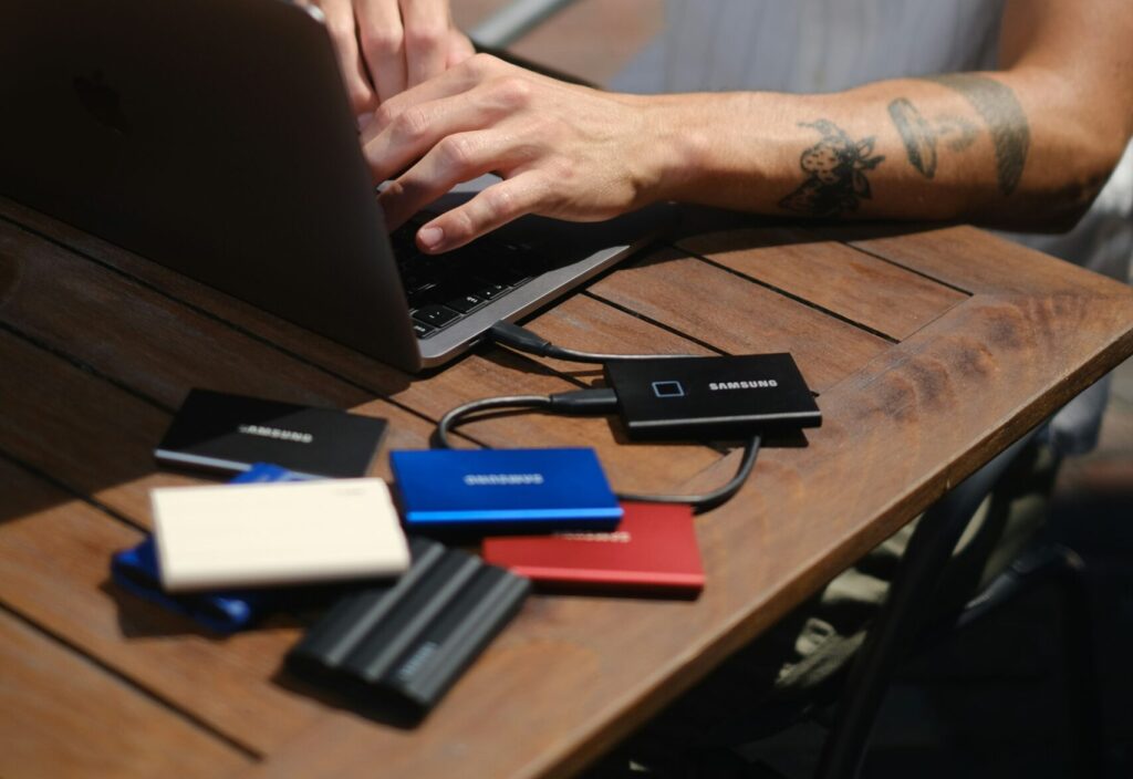 Keep Your Data Safe: Man with several external hard drives