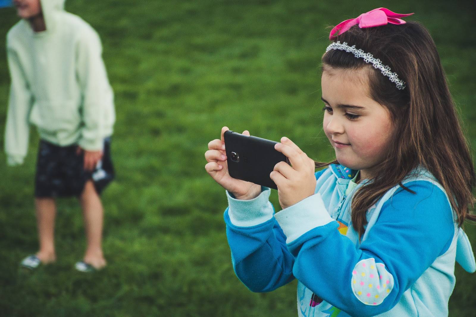 Little girl on a smart phone