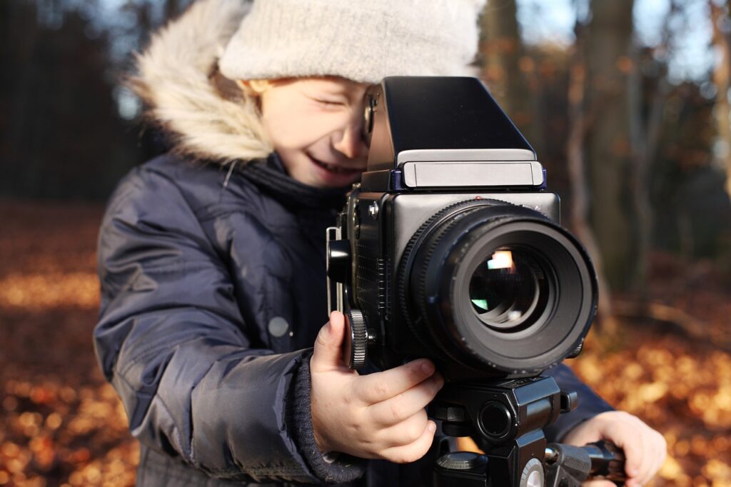 child taking a photo