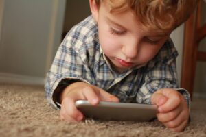 Kid playing video game