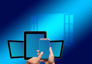 Windows graphic with phone and tablets.