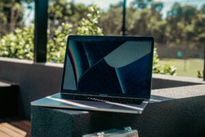 Laptop sits couch after a recent MacBook hardware repair.