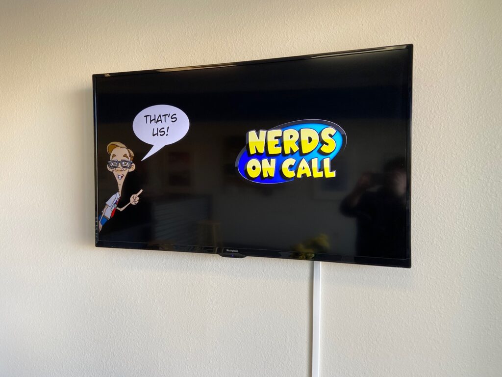 TV in the lobby of the Nerds On Call Sacramento location
