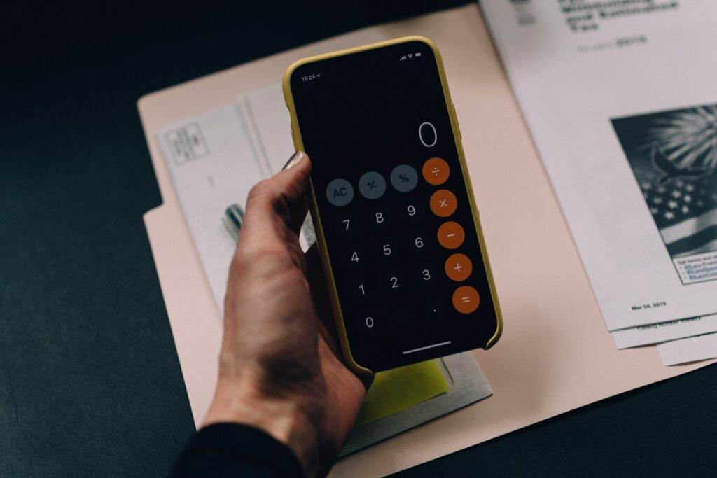 A person using the iPhone Calculator app.