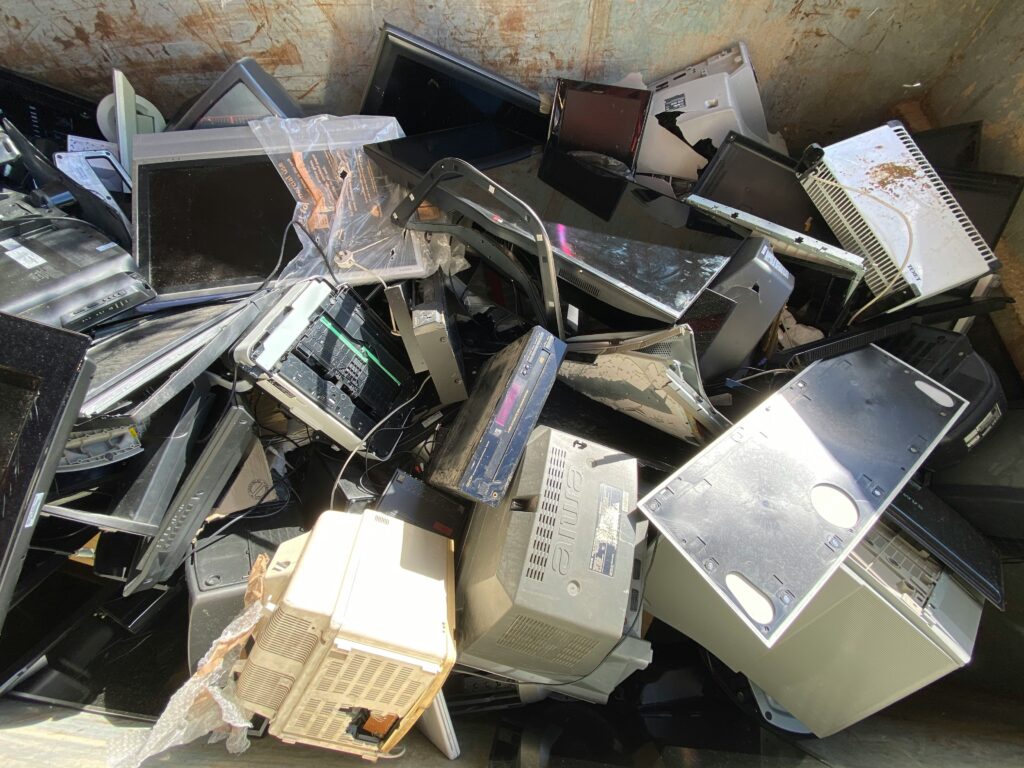 Electronic Waste: old computers in the middle of dump.