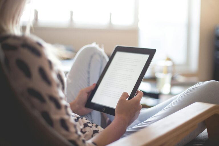 A person is working on a tablet.