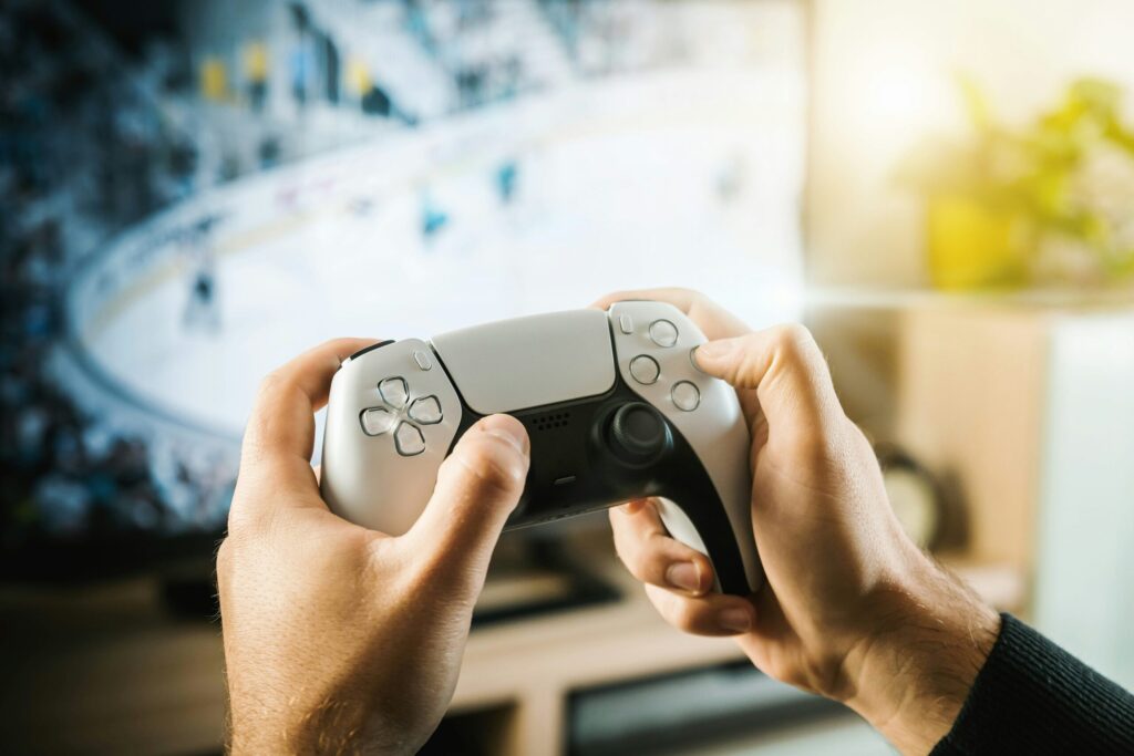PlayStation Overheating Repair Redding - someone playing a PS5