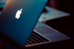 Roseville Macbook hardware: MacBook partially closed in dim light
