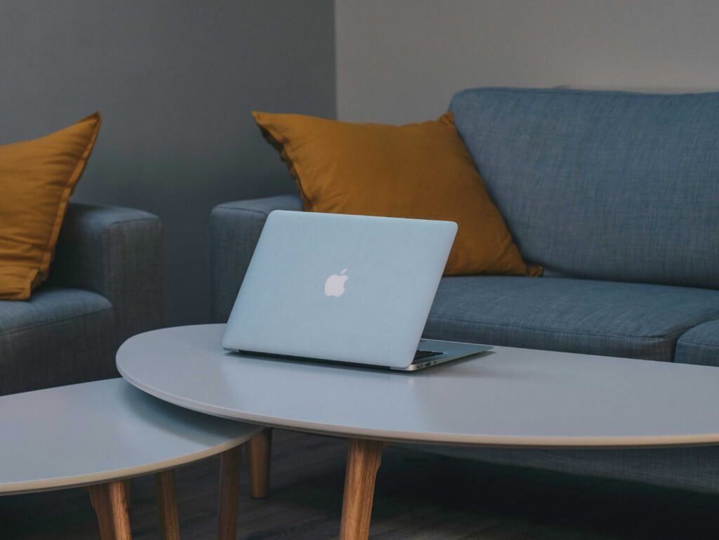 MacBook Air Repair: MacBook Air on a table next to a few couches