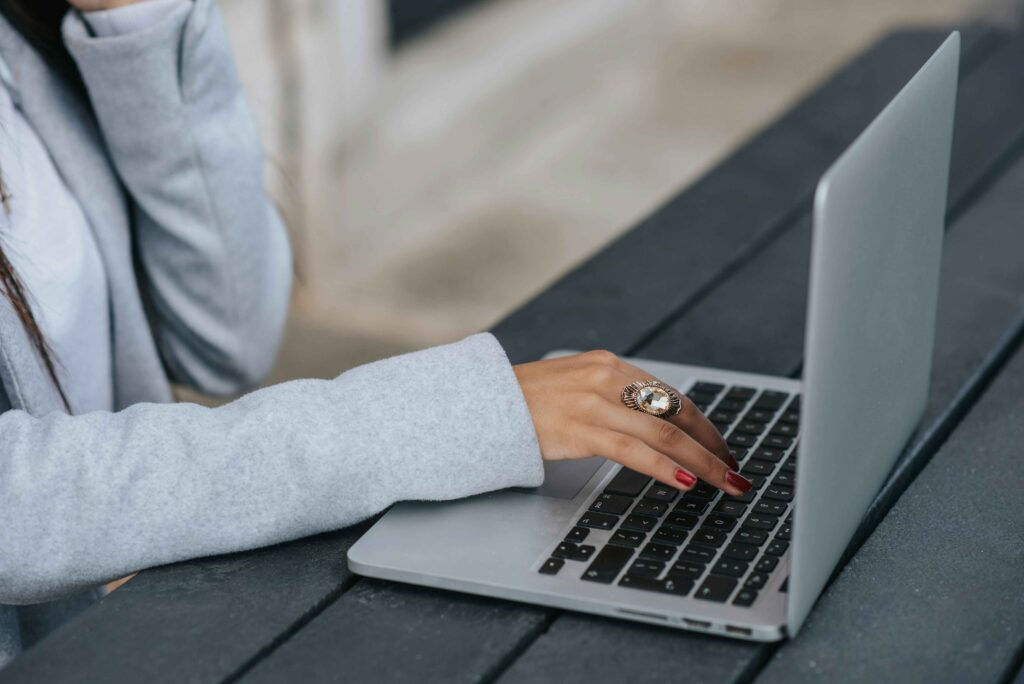 Woman typing on a laptop