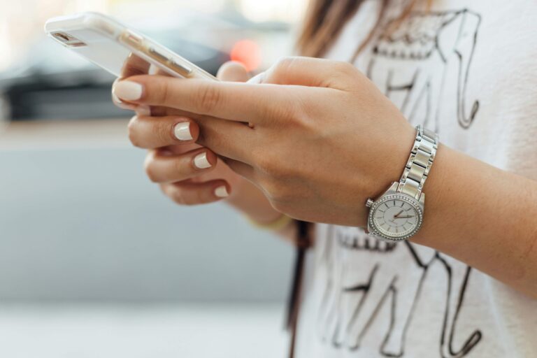 Cell Phone Repair Fresno - Women holding phone