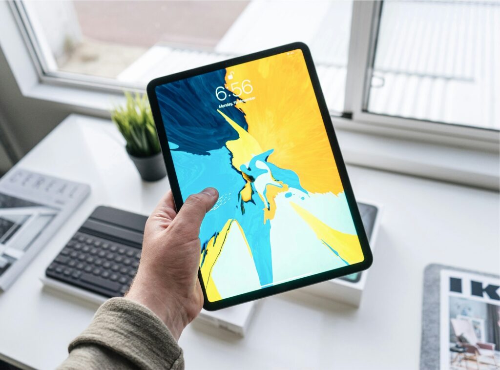 A person holding an iPad