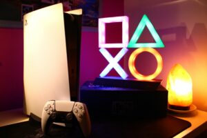 PlayStation Overheating Repair Chic: PS5 on desk with neon lights