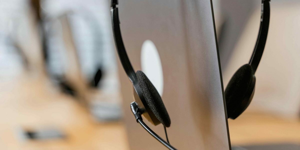 Remote Computer Support: A laptop with headset on top